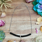 Black onyx necklace with sterling silver center bead on paperclip chain, 16 inch length with extender, handmade jewelry.
