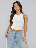 Round neck cropped tank in neutral color with slight stretch, perfect for layering with high waisted jeans or casual outfits