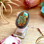 large turquoise statement ring with adjustable sterling silver band handmade by The Bijoux FAB.