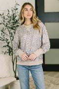 Patchwork French terry crew neck pullover with exposed seams, drop shoulders, banded hem, and relaxed everyday fit.