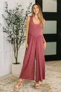 Mauve wide leg jumpsuit with ribbed knit fabric, elastic waist, and relaxed flattering fit.