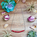 Silver plated paperclip chain necklace with dyed coral and hematite accents, 15 inch Western statement jewelry piece