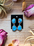 Golden Hill turquoise dangle earrings in sterling silver with lavender blue stones handmade in New Mexico USA.