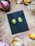 Palomino variscite sterling silver stud earrings handmade by Jason Ogg with natural green stone and matrix pattern.