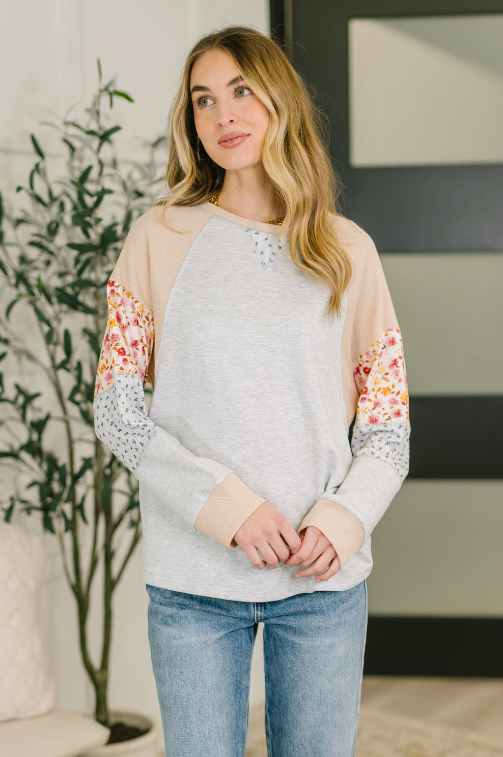 Mixed fabric long sleeve top with French terry body and waffle knit contrast sleeves in relaxed fit.
