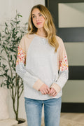 Mixed fabric long sleeve top with French terry body and waffle knit contrast sleeves in relaxed fit.