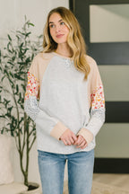 Mixed fabric long sleeve top with French terry body and waffle knit contrast sleeves in relaxed fit.
