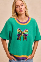 BiBi Mardi Gras sequin ribbon patched sweater top, festive purple gold green accents, long sleeves, soft sweater knit fabric, casual relaxed celebration top
