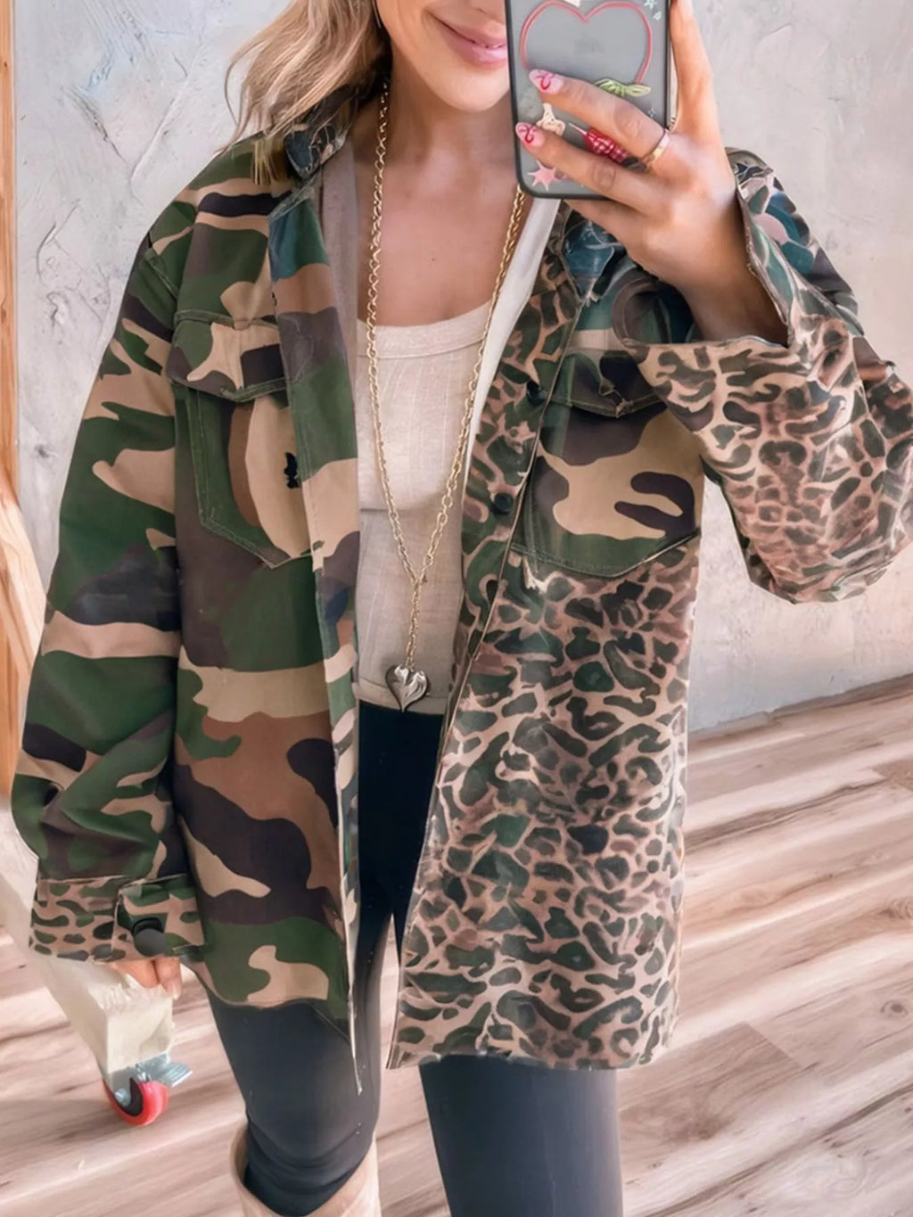 Oversized 100% cotton jacket with classic army camo and leopard print mix. Button front, pockets, unlined body. Bold pattern blend for casual, outdoor, everyday fits.