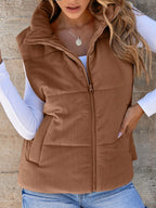 Brown padded corduroy zip vest with pockets. A warm, rugged, country staple that layers perfectly over tees and flannels.