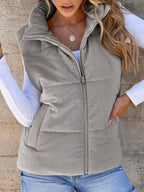 Gray padded corduroy zip vest with pockets. Soft-ribbed texture, cozy padding, and a casual country layer for everyday comfort styling.