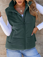Green padded corduroy zip vest with pockets. Earthy country-cool layer perfect for denim outfits, boots, caps, and everyday cozy style.