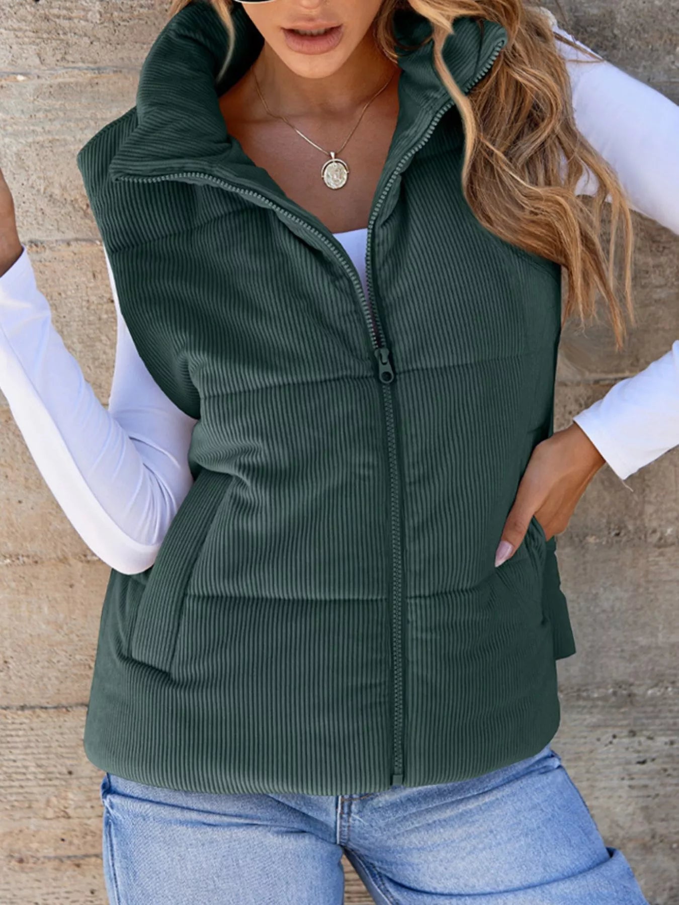 Green padded corduroy zip vest with pockets. Earthy country-cool layer perfect for denim outfits, boots, caps, and everyday cozy style.