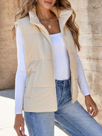 Off-white padded corduroy zip vest with pockets. Soft neutral tone, cozy padding, and a classic country layering essential for any season.