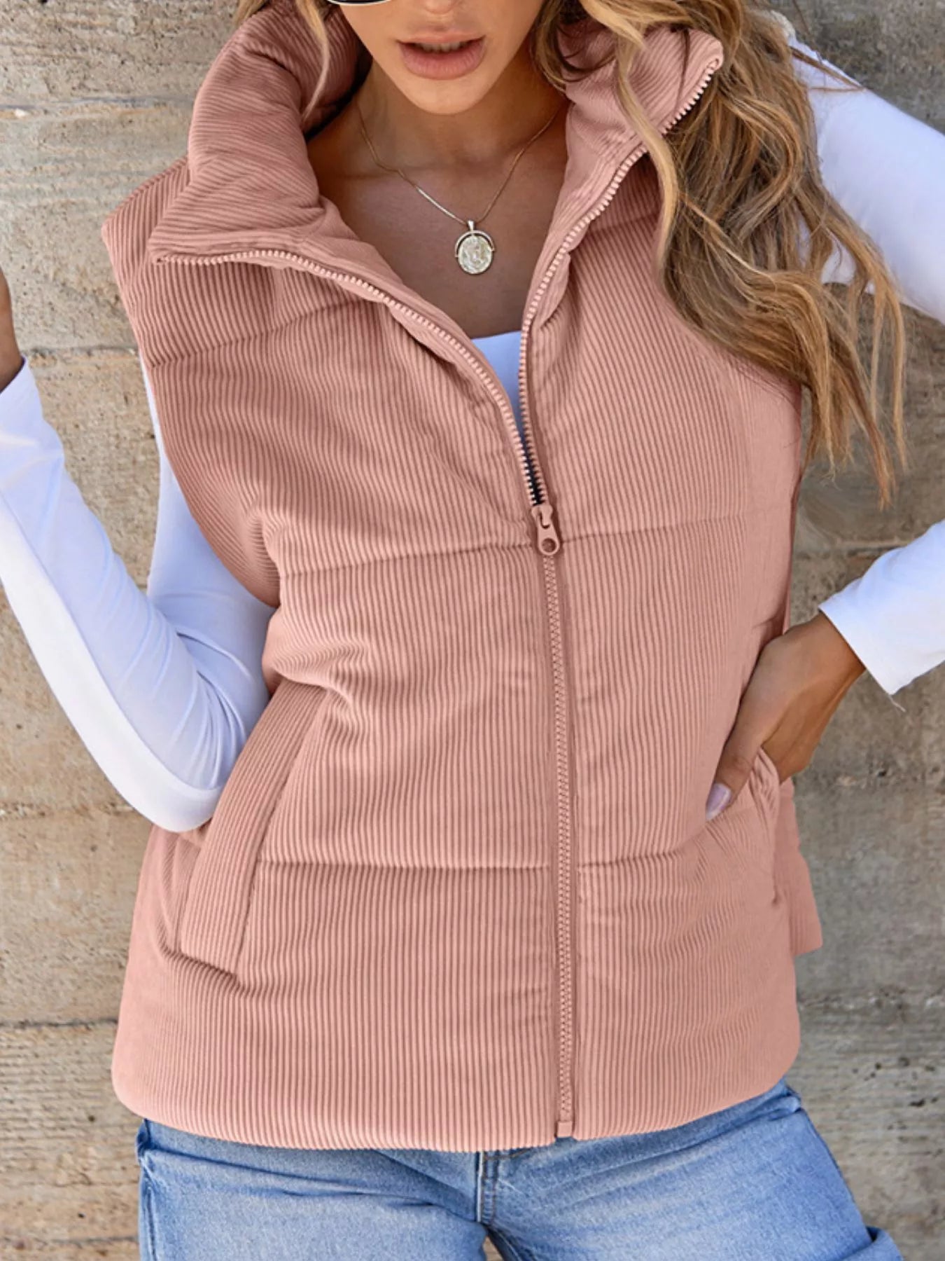 Pink padded corduroy zip vest with pockets. Cute country layer that pairs effortlessly with denim, caps, boots, and casual everyday looks.