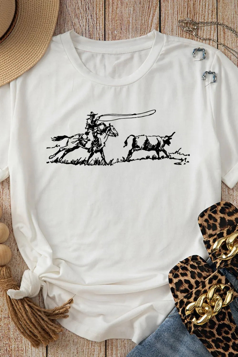 Women’s graphic tee with cowboy steer roping design, casual short sleeve t-shirt for western casual and rodeo everyday outfits.