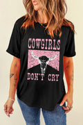 Women’s black graphic tee with pink Cowgirls Don’t Cry print, retro western casual rodeo shirt for denim, boots, and everyday outfits.