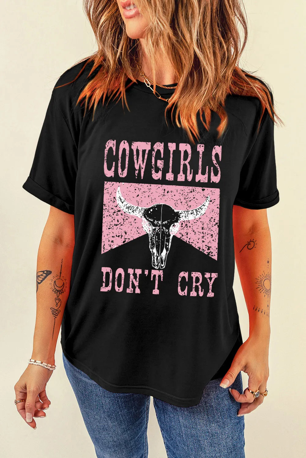 Women’s black graphic tee with pink Cowgirls Don’t Cry print, retro western casual rodeo shirt for denim, boots, and everyday outfits.