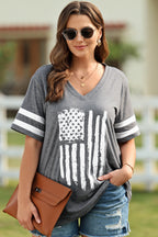 Gray plus-size graphic tee with a bold white flag design. Comfortable 1X–4X fit, perfect for denim, casual layers, sidelines, and everyday style.