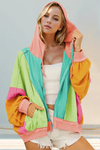 Teal sherbet hoodie with lime, mint, pink, and orange color block panels. Zip up, drawstring hood, exposed seams, and pockets for fun layering.