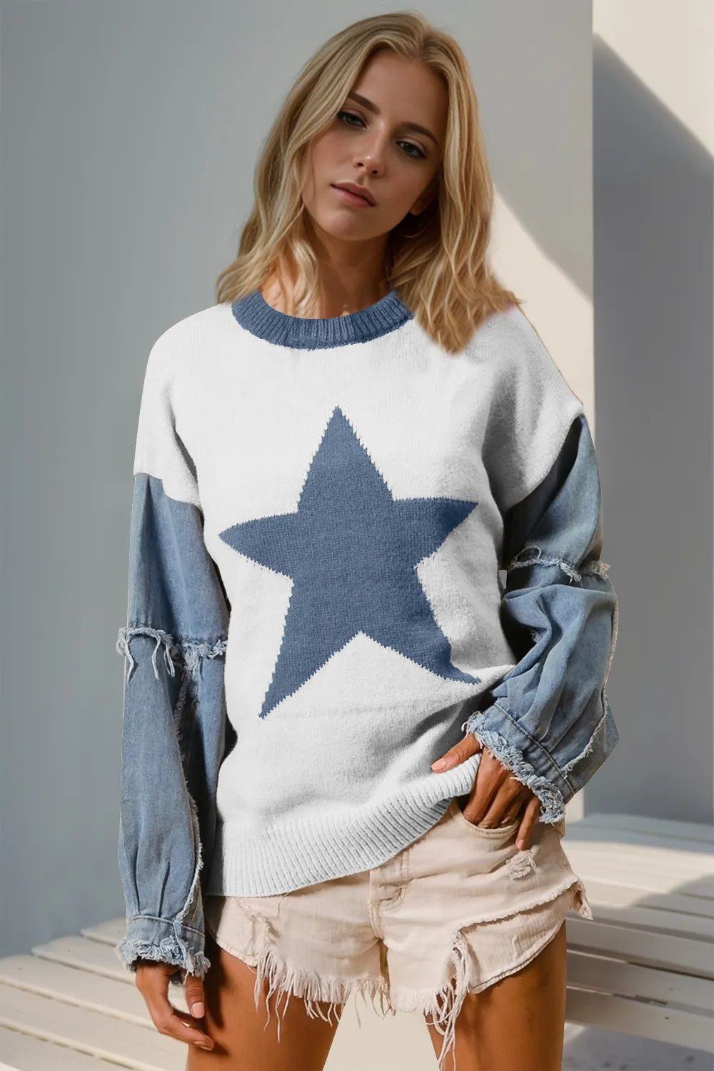 denim-accent knit sweater with star pattern, raw-edge hem, long sleeves, slight stretch, cozy boutique layering style for jeans or western boots