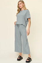 Cloudy blue textured tee and wide leg pant set with pockets. Soft sky-blue tone, comfy fit, perfect for casual layering looks.