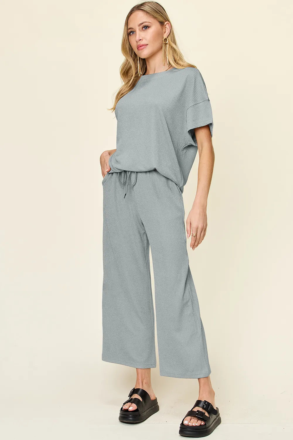 Cloudy blue textured tee and wide leg pant set with pockets. Soft sky-blue tone, comfy fit, perfect for casual layering looks.