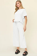 White textured short sleeve top and pocketed wide leg pants. Crisp, lightweight, relaxed, and effortless for everyday wear.