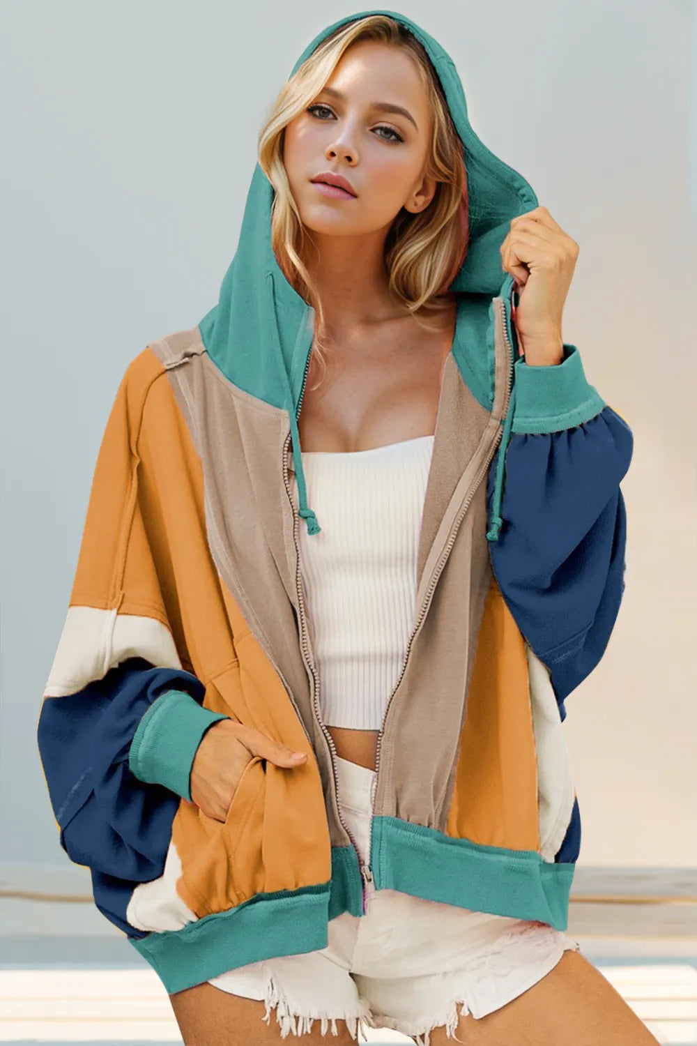 Khaki hoodie with mustard, teal, navy, and ivory color block panels. Zip front, drawstring hood, and pockets for a bold western casual look.