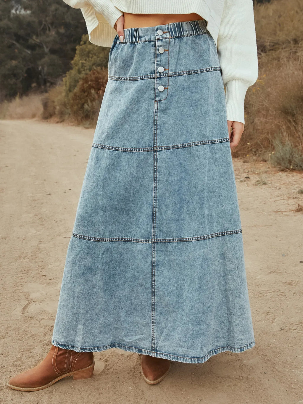 Women’s tiered maxi denim skirt with button-front design, flowing silhouette for casual western and everyday outfits.