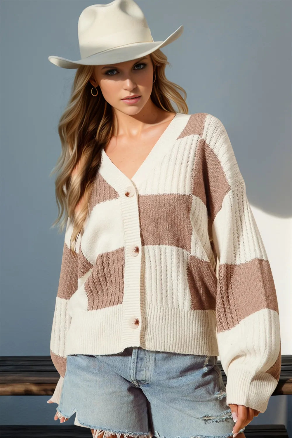 Ivory and tan check knit cardigan with buttons, dropped shoulders, soft stretch. Western boutique style for rodeo nights, ranch mornings, and outdoor cowgirl layering.