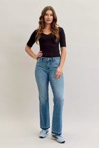 Women’s mid-rise Judy Blue bootcut jeans with smoothing and shaping stretch denim, slim retro fit, flattering everyday casual and western style.