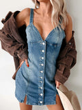Denim mini dress with a button front, sweetheart neckline, spaghetti straps, and a fitted shape. Nashville-cute with boots or heels.