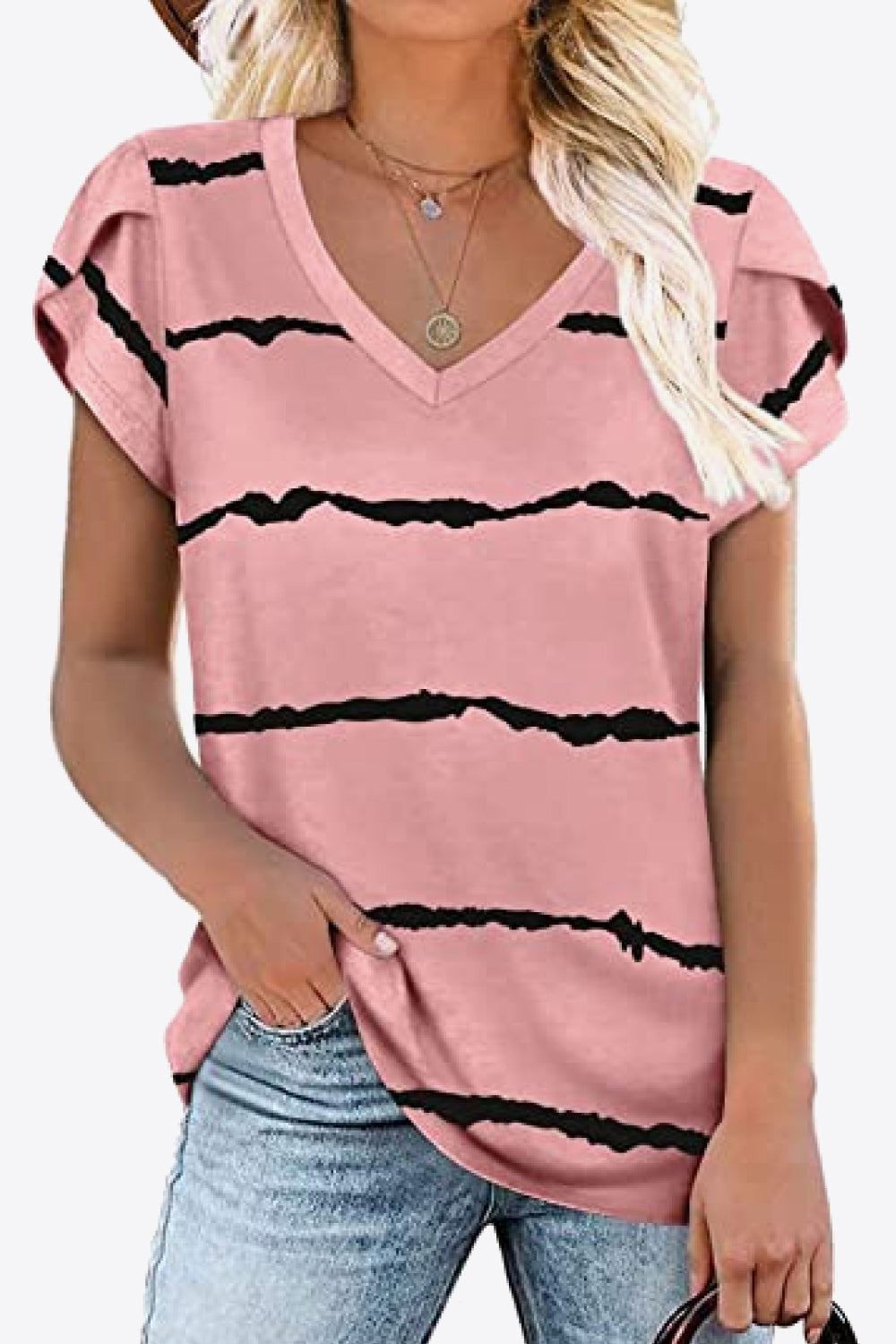Blush pink blouse with black squiggle stripe print. Petal sleeves, high stretch knit, casual everyday boutique top.