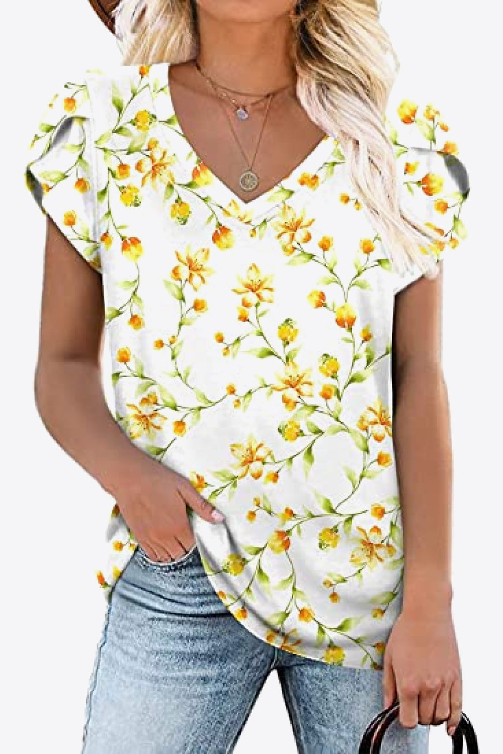 Ivory V-neck blouse with yellow floral print and petal sleeves. Soft stretch rayon-blend knit, short sleeve everyday spring top.