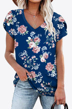 Navy background blouse with blush pink floral print. Petal sleeves, high stretch knit, casual country-cute everyday layer.