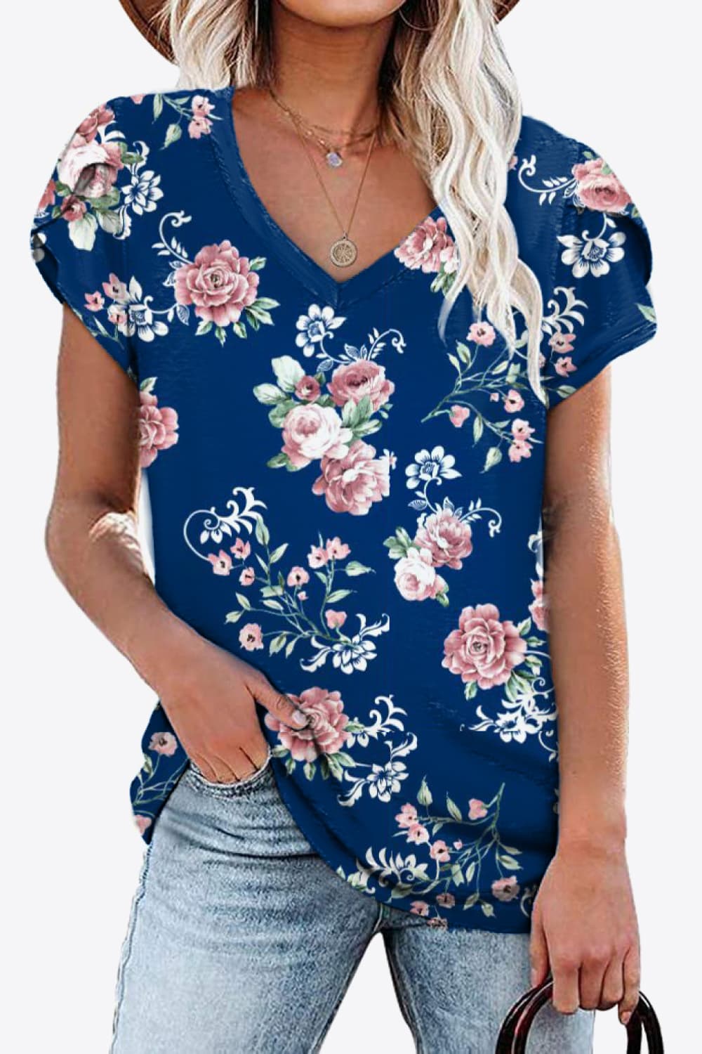 Navy background blouse with blush pink floral print. Petal sleeves, high stretch knit, casual country-cute everyday layer.