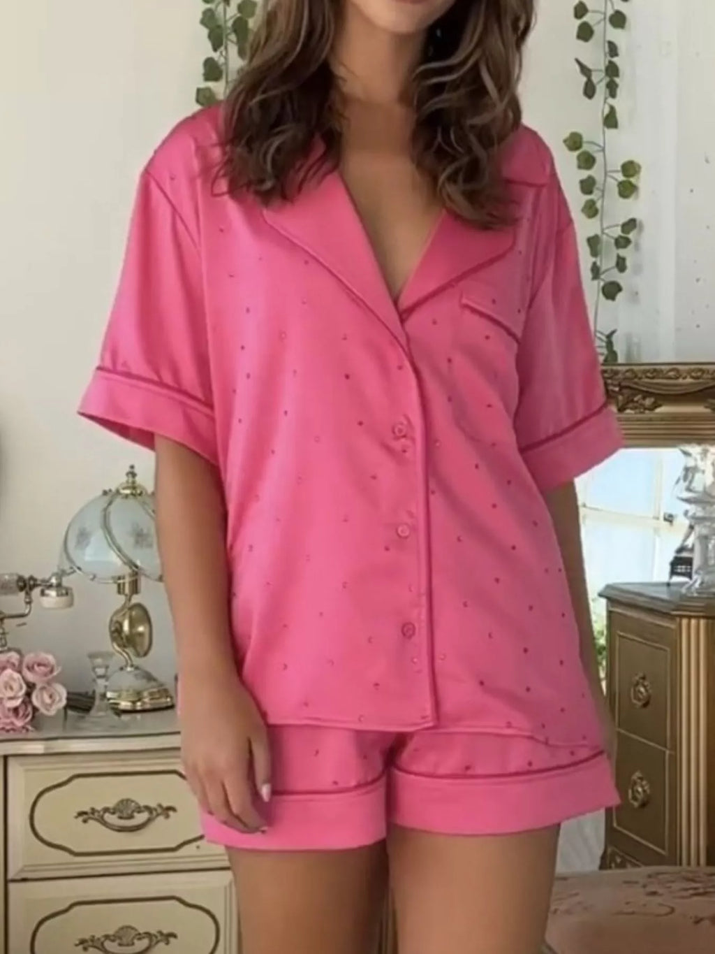 Women’s button-up pajama lounge set with half sleeve shirt and soft lounge shorts in pink-on-pink stitched dot pattern, lightweight, cozy, monochrome casual sleep and lounge style
