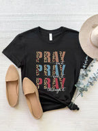 Black prayer statement tee with a bold faith graphic. Classic fit, wardrobe staple for casual, layered, or cozy everyday style.