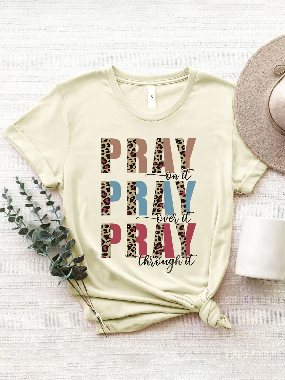 Cream short-sleeve tee with an inspiring prayer statement. Soft neutral tone, relaxed fit, and perfect for layering or wearing solo.