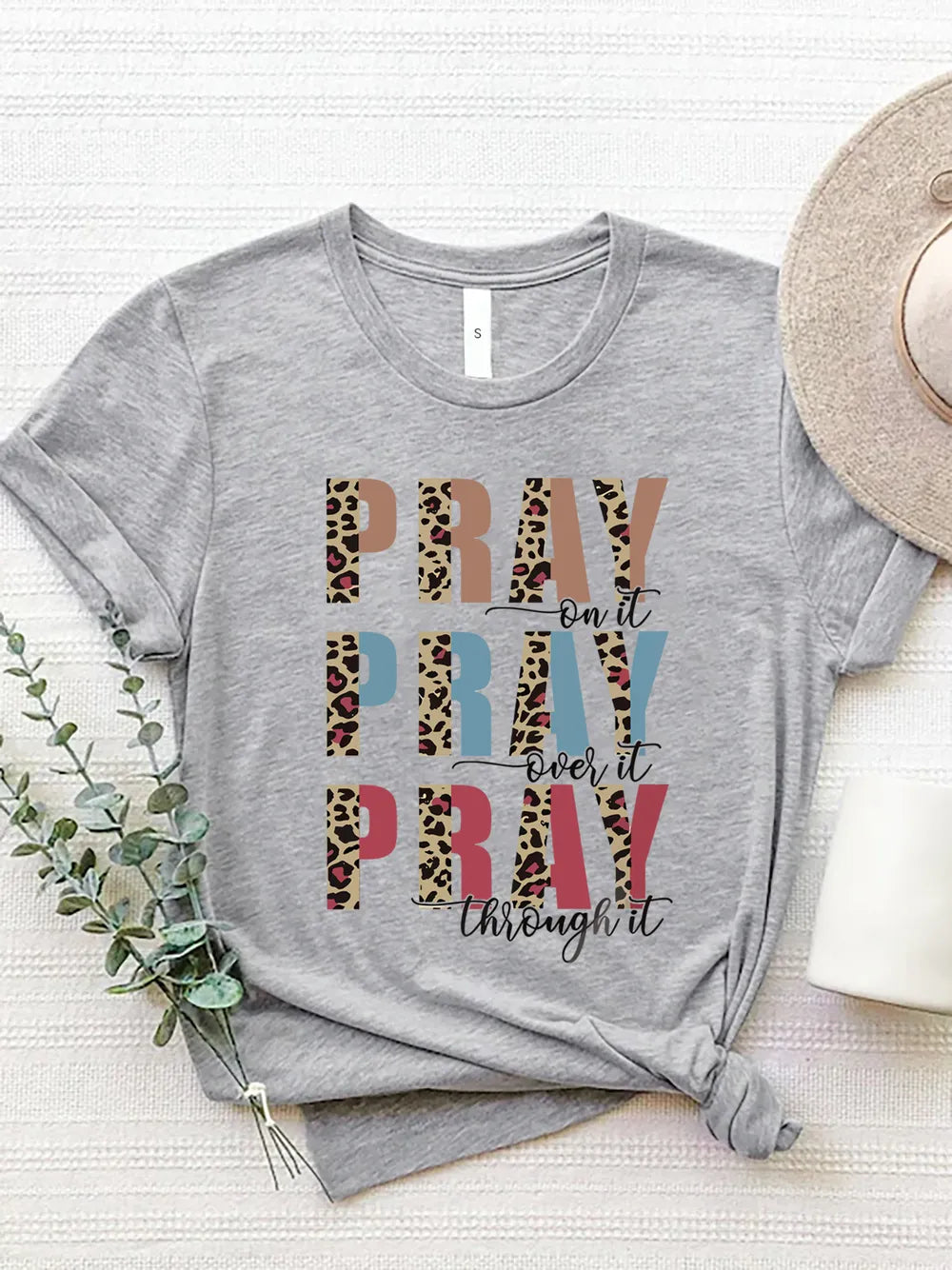 Gray tee with a bold prayer-based message. Casual fit, easy to layer, timeless, comfy, and made for everyday wear.