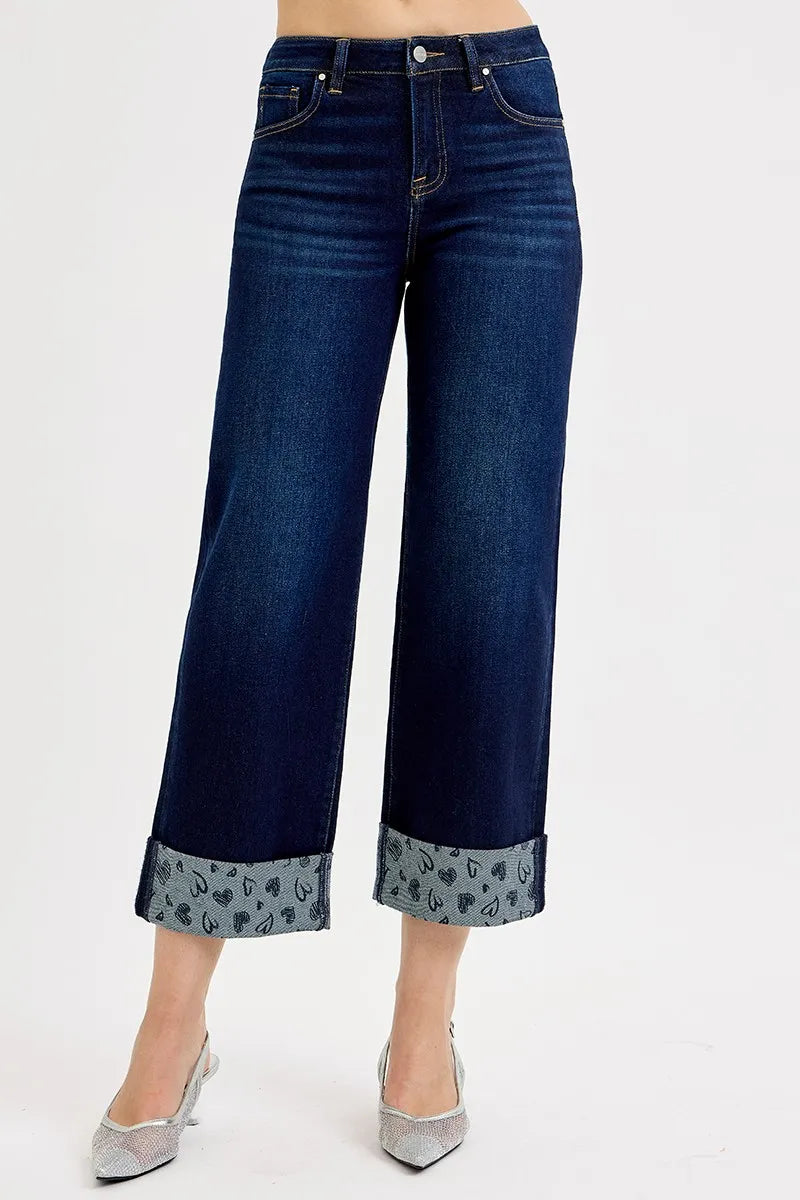 Cropped wide-leg jeans with printed heart-cuff hems. Mid-rise fit, 5-pocket design, soft everyday denim that pairs with sneakers or boots.