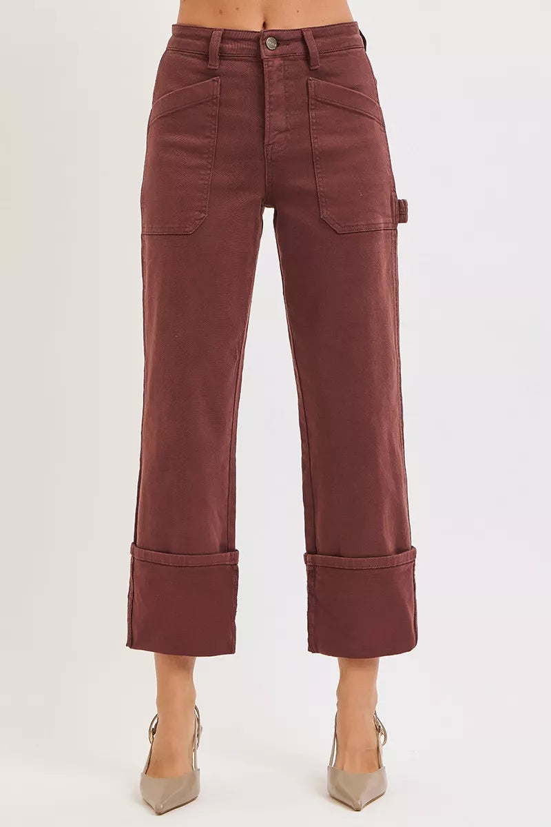 Women’s high-rise carpenter jeans by RISEN in burgundy brown, wide straight leg, utility pocket details, durable retro western casual denim.