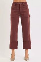 Women’s high-rise carpenter jeans by RISEN in burgundy brown, wide straight leg, utility pocket details, durable retro western casual denim.