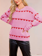 Rose red long sleeve knit sweater with 4 rows of matching red hearts. Relaxed dropped shoulder fit, soft, opaque, everyday pullover style.