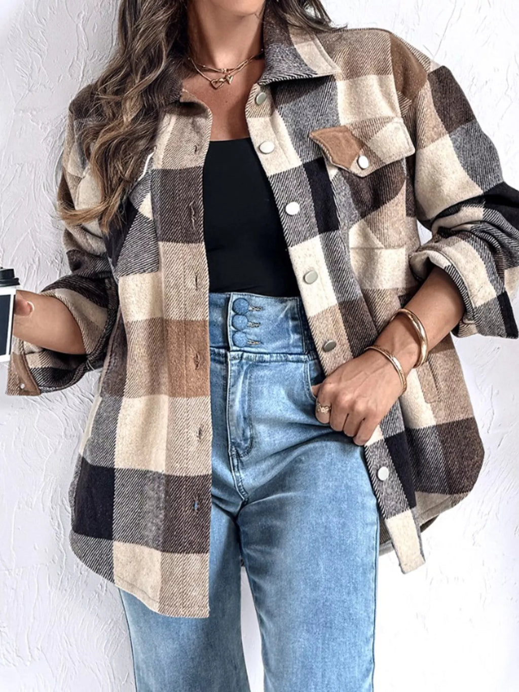 Khaki brown and black plaid button-up with long sleeves and front pockets. Opaque, soft, relaxed fit, everyday casual shirt.