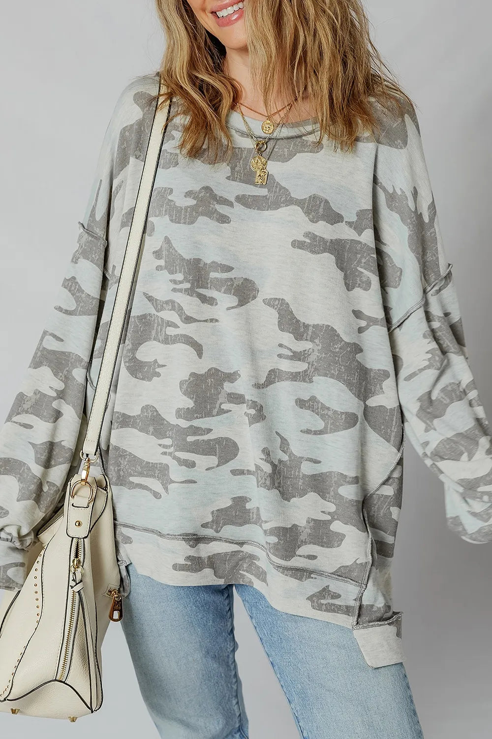 Sage green and gray camouflage long sleeve pullover with a relaxed high-low hem. Soft, opaque sweatshirt feel with a hint of stretch for casual everyday wear.