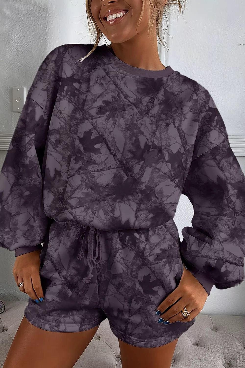 Olive brown woodland camo lounge set with a pullover top and drawstring shorts. Baggy, stretchy, cozy pajama-style loungewear.
