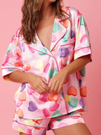 Women’s button-up pajama shirt and lounge shorts set in Valentine hearts print, soft fabric, relaxed fit, cute cozy sleepwear for home lounging and casual nights