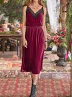 Burgundy velvet mid-calf cami dress with black lace trim. Spaghetti straps, slightly stretchy, opaque fabric, soft drape, feminine everyday fit.